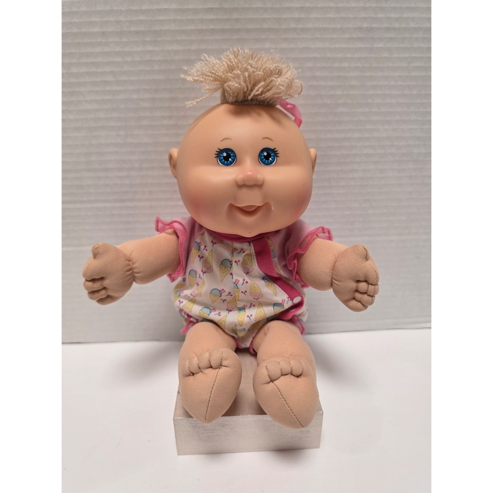 2004 vintage Cabbage Patch Kids preemie doll with blonde yarn hair and blue eyes